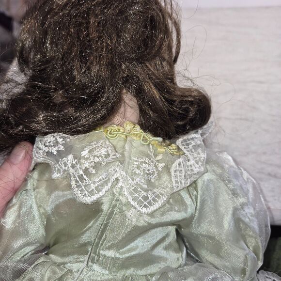Heirloom Treasure Doll, Dark Long Curley Hair with Green Dress and Bow on Front - Picture 10 of 10